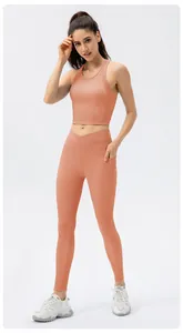 Detail view of peach sports yoga set showing ribbed texture and side pockets on leggings
