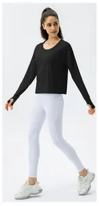 Detail of UV protection long sleeve top with thumb holes and fitness leggings with pockets