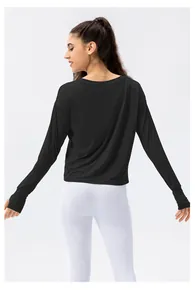 Close-up of black long sleeve sun protection top with thumbhole cuffs and back detail