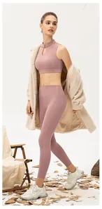 Detail of high-waist yoga pants and mandarin collar sports vest in dusty rose pink