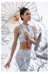 Detail of traditional Chinese frog button and teardrop cutout on floral yoga vest