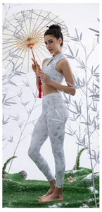 Detail view of oriental style yoga set with ink floral prints and Chinese frog buttons
