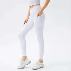White high waisted ribbed yoga pants with crossover waist and side pockets for fitness