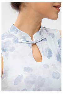 Detail of high neck yoga bra featuring traditional Chinese knot and teardrop cutout