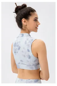 Detail of floral yoga vest featuring high collar and blue purple gradient print