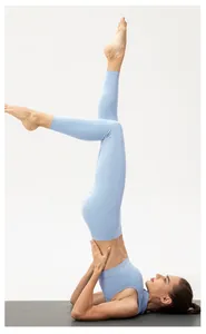 Detail of light blue yoga set featuring traditional mandarin collar and frog button design