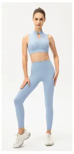 Close-up of light blue yoga set featuring a mandarin collar and hollow-out sports bra detail