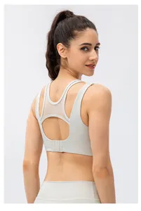 Detailed back view of women's sports bra featuring mesh panels and three-row hook closure