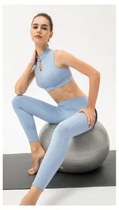 Detail of light blue yoga set with mandarin collar cut-out top and high waist leggings