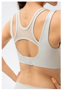 Close-up of women's sports bra with breathable mesh panel and adjustable back buckle