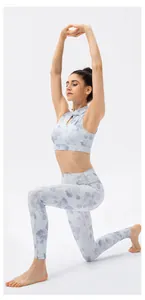 Detail of light blue yoga set with floral patterns and traditional Chinese frog buttons