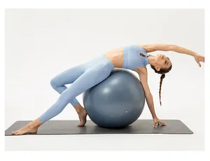 Detail of light blue high-stretch yoga set showing seamless fabric during stretching
