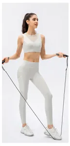 Detail of breathable mesh panel on yoga bra and side pockets on high waist leggings