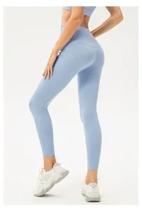 Detail of high-waisted seamless light blue yoga leggings with breathable performance fabric