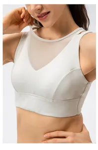 Close-up of beige sports bra featuring V-shaped mesh splicing for breathability