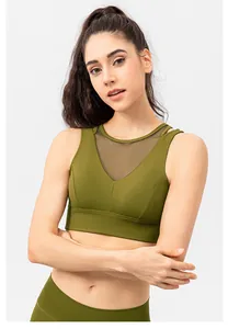 Detail of olive green sports bra with breathable black mesh v-neckline patchwork