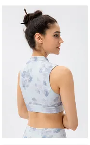 Close-up of floral yoga crop top with mandarin collar and traditional frog button detail
