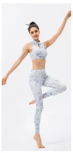 Detail of yoga set showing vintage floral print on high-neck vest and high-waist leggings