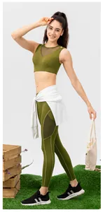 Detail of olive green yoga sports bra with black mesh stitching and breathable fabric