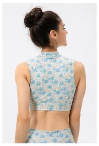 Detail view of the back of a blue floral yoga top with Chinese style frog button design