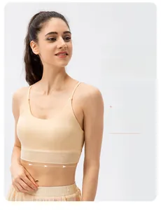 Detail view of beige yoga bra featuring breathable mesh paneling and soft nude fabric