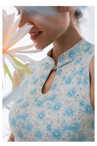 Detail of mandarin collar and floral pattern on light blue Chinese style yoga top