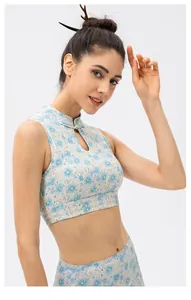 Detail of mandarin collar and frog button on floral yoga top with teardrop cutout