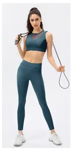 Detail of dark teal yoga set with breathable mesh stitching and high waist leggings