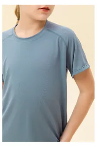 Detail of kids breathable mesh sports t-shirt with raglan sleeves in misty blue