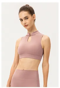 Close-up of pink yoga vest with traditional Chinese frog buttons and mandarin collar