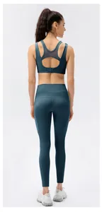 Detail of navy blue sports bra with breathable mesh panel and back clasp closure