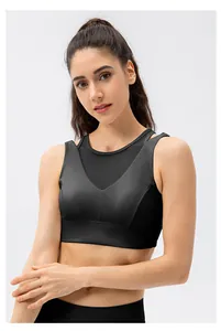 Detail of black layered sports bra featuring breathable mesh panels and supportive wide hem