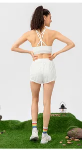 Rear view of white yoga bra with crisscross straps and breathable mesh fabric