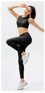 Detail of black high-waisted leggings with side pocket and breathable athletic fabric