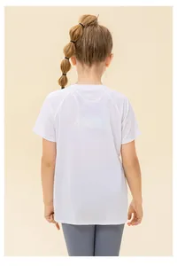 Rear view of child in breathable white mesh sport T-shirt and grey leggings