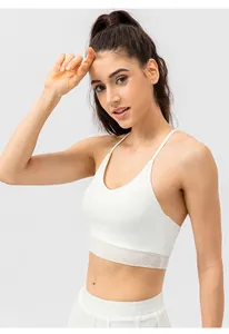 Detail of white sports bra showing breathable mesh texture and V-neck with thin straps