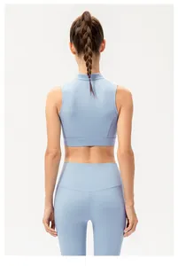 Rear view of light blue yoga set featuring a high-waisted leggings and sports vest