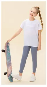 Detailed view of girls' white breathable mesh sports t-shirt and grey leggings