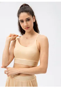 Front view of nude seamless yoga bra with slim straps and wide supportive underband