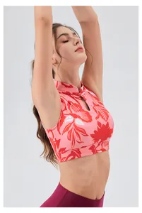 Detail of pink floral yoga top with Chinese frog button and teardrop cutout neck