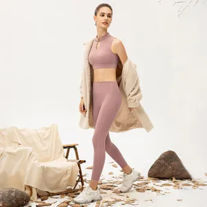Pink yoga set with Chinese frog button top and leggings styled with beige fleece coat