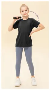 Kids quick-dry sports set featuring black short sleeve t-shirt and blue athletic leggings