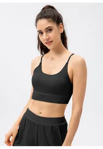 Close-up of black yoga bra and shorts set with thin straps and elastic high waist