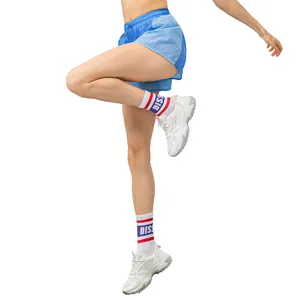 Pantaloncini sportivi da donna con fodera interna e design patchwork blu
