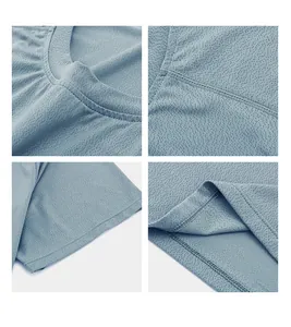 Detailed view of breathable mesh fabric and reinforced stitching on a blue sports T-shirt