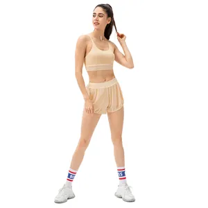 Women's beige yoga set with padded sports bra and double-layer breathable shorts