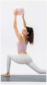 Detail view of high-elastic lilac sports vest and grey high-waist yoga leggings