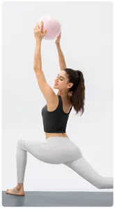Side view of high-waist yoga leggings with side pockets and black athletic tank top