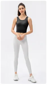 Front view of high-impact black sports crop top and grey high-waist yoga leggings