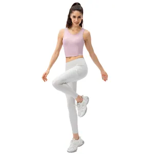 Women's pink shockproof sports vest and white high-waist leggings with side pockets